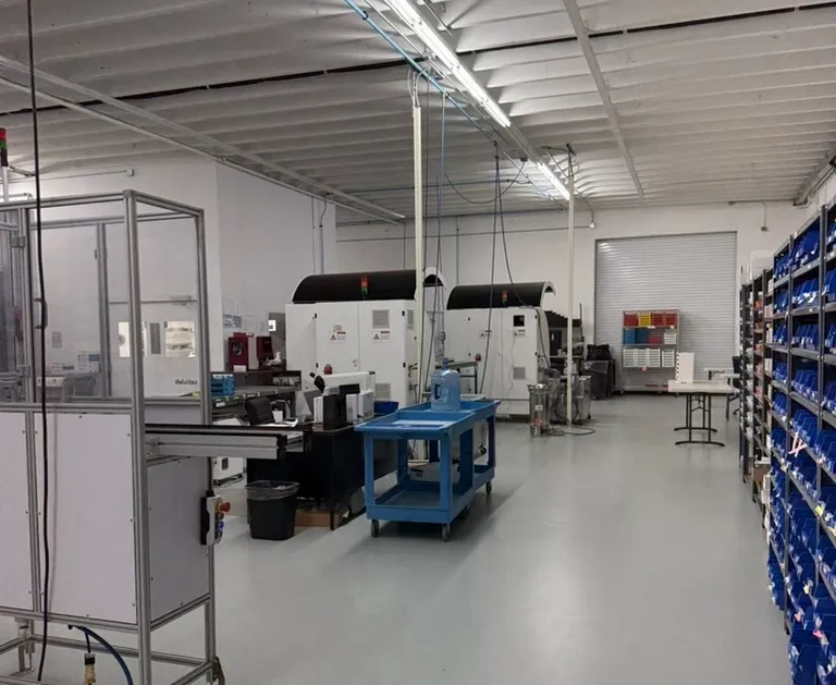 Stock bins and finishing benches on the ITFIT lab floor